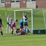 Field Hockey players cheer after a teammate scored a goal